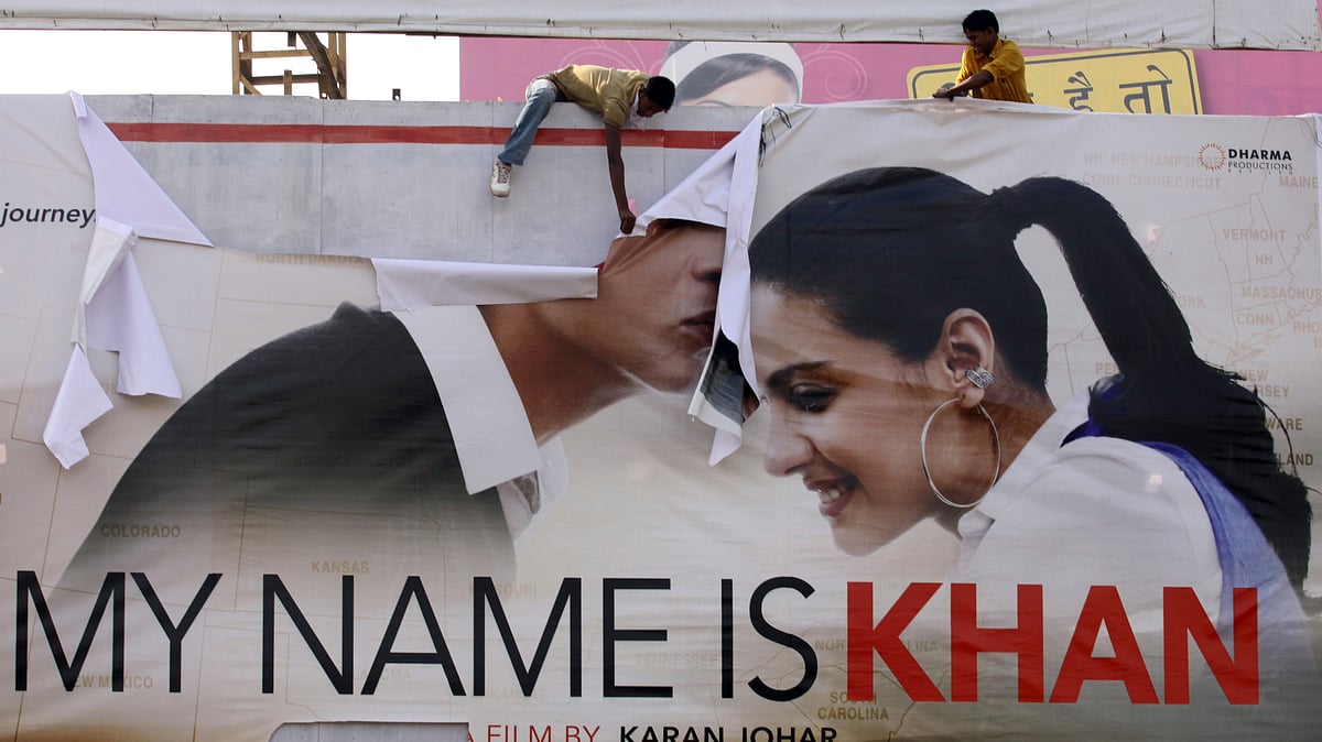 Supporters of Shiv Sena tear a poster of Bollywood actor Shah Rukh Khan’s new film “My Name is Khan” during a protest in Ahmedabad on February 12, 2010. (Photo: Reuters)