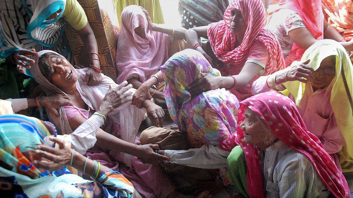 Relatives of the Dalit family mourn the death of the two children. (Photo: PTI)