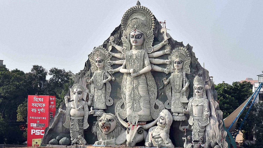 The world’s so-called tallest Durga idol being closed for visitors at Deshapriya Park in Kolkata on Monday following a mini-stampede Sunday evening. (Photo: PTI)