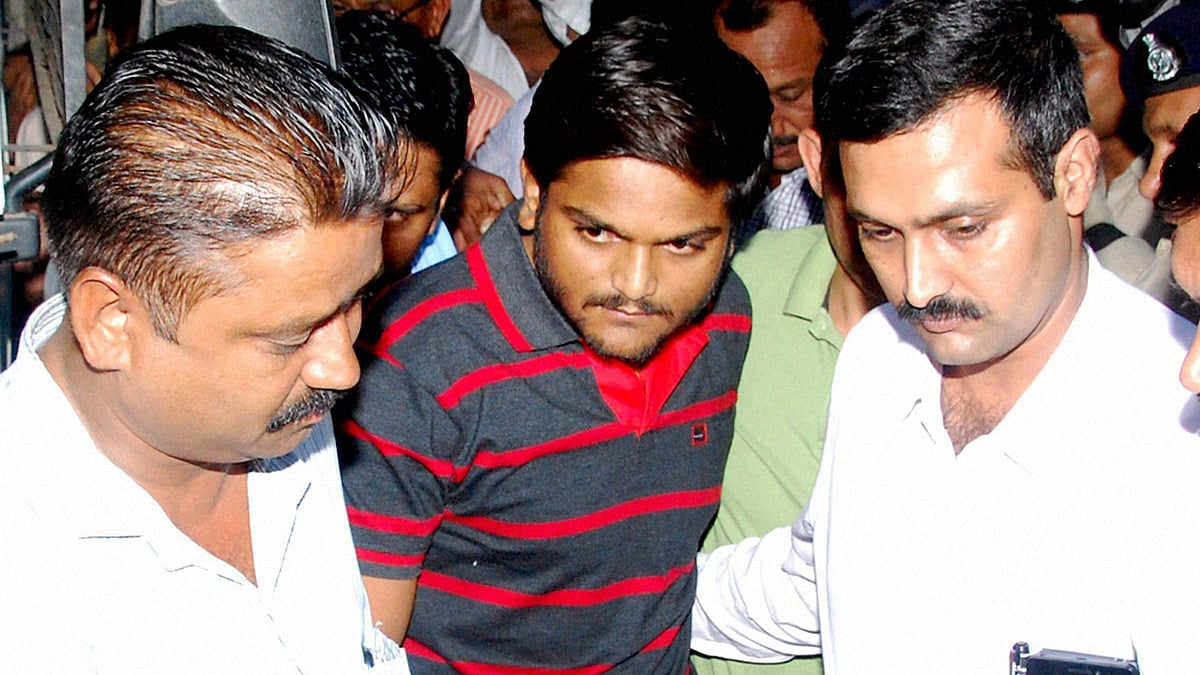 Patel quota agitation leader Hardik being escorted by the police after his arrest. (Photo: PTI)