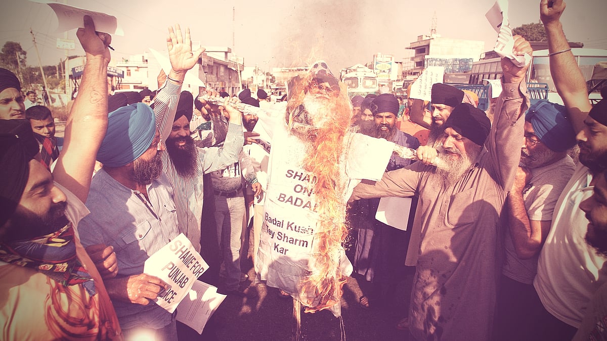 Sikhs burn an effigy of Punjab state Chief Minister Parkash Singh Badal during a protest against the killing of two Sikh boys, in Jammu, India. (Photo: AP)
