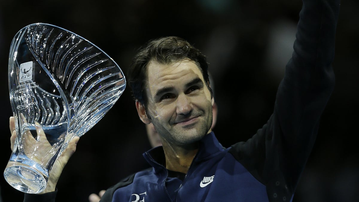 Roger Federer lifts the ATP Fans’ Favourite award during the ATP World Tour Finals at the O2 Arena in London on Sunday. (Photo: AP)