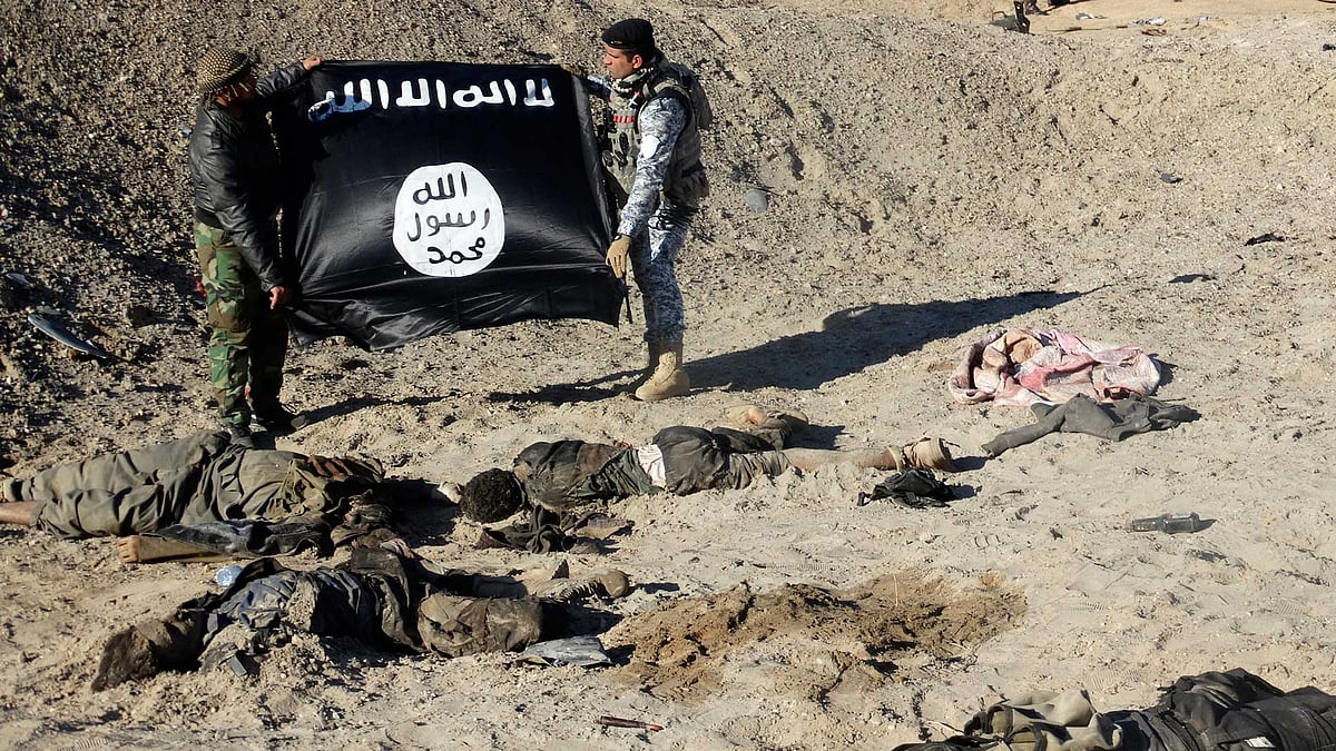 The ISIS flag is held over militants who were killed in an encounter with Iraqi security forces. Image used for representational purposes. (Photo: Reuters)
