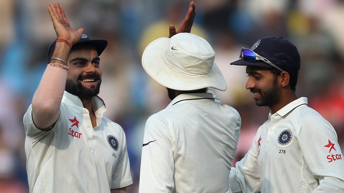 Indian cricketers, (from left to right), Virat Kohli, Ravindra Jadeja and Ajinkya Rahane, celebrate as India wins against South Africa on the third day of the third cricket Test match between the two countries in Nagpur, November 27, 2015. (Photo: AP)