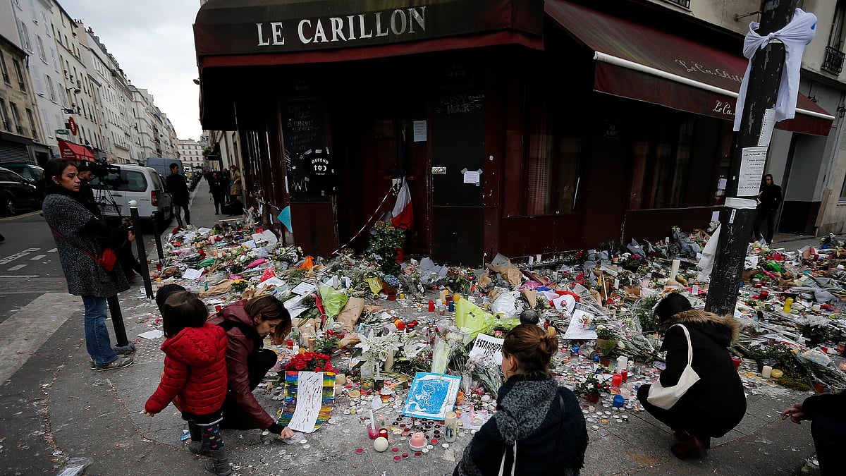 People mourn for the victims of 13/11. (Source: AP)