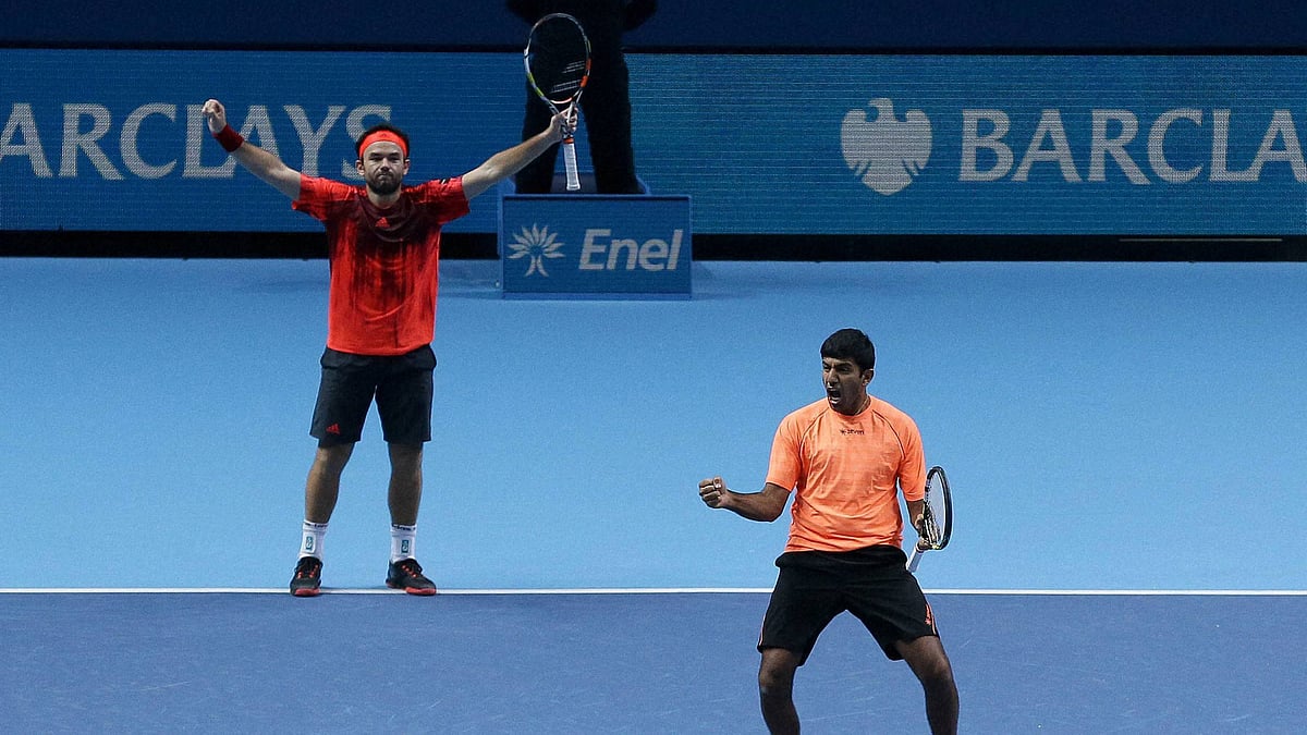 India’s Rohan Bopanna (right) and Romanias Florin Mergea celebrate winning their ATP World Tour Finals doubles tennis match. (Photo: PTI)