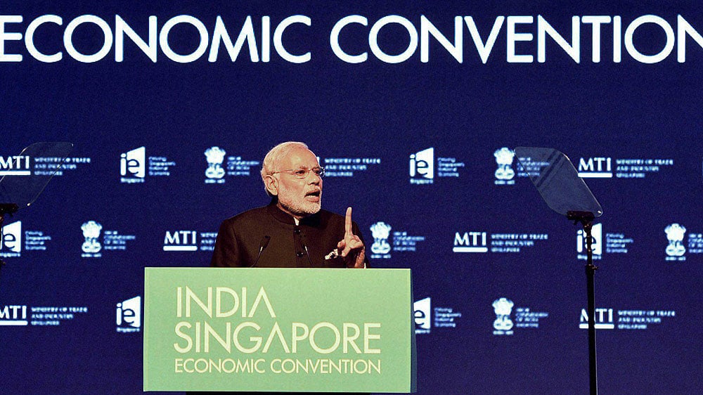 Prime Minister Narendra Modi addressing a gathering at the India-Singapore Economic Convention at the Marina Bay Sands Convention Centre, in Singapore on Tuesday. (Photo: PTI)