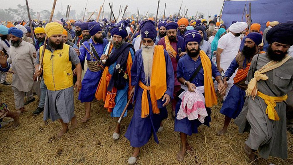 Nihangs arrive to participate in the Sarbat Khalsa with their traditional weapons at Chaba village near Amritsar. (Photo: PTI)