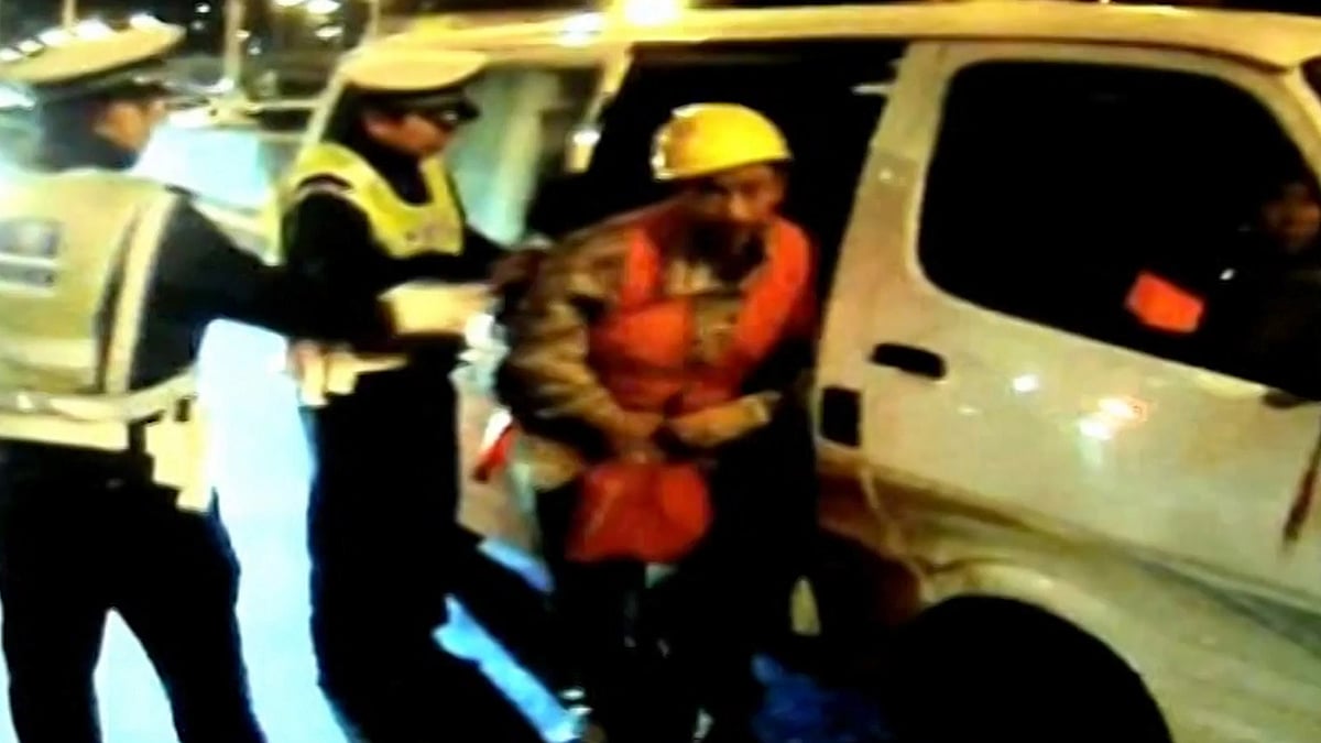 A worker exits the minivan in which 34 such workers were found stuffed in Sichuan Province, China. (Photo: AP/Newsflare screengrab)