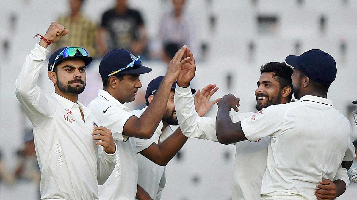 India’s  Jadeja celebrates with teammates after picking the wicket of Faf du Plessis. (Photo: PTI)