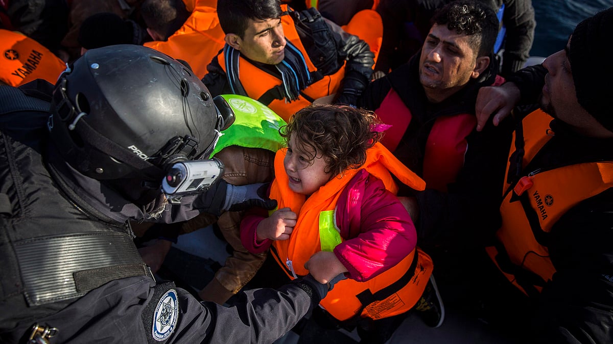 Members of the Frontex, European Border Protection Agency, from Portugal rescue 56 people, who were lost in an open sea as they try to approach in a dinghy on the Greek island of Lesbos, Tuesday, December 8, 2015. (Photo: Reuters)