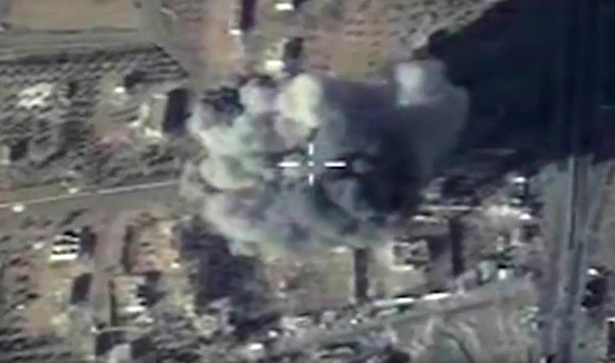 Visual on Russian Defense Ministry official website showing Russian attack on local headquarter of ISIS in Syria provided on Wednesday, December 9, 2015. (Photo: AP)