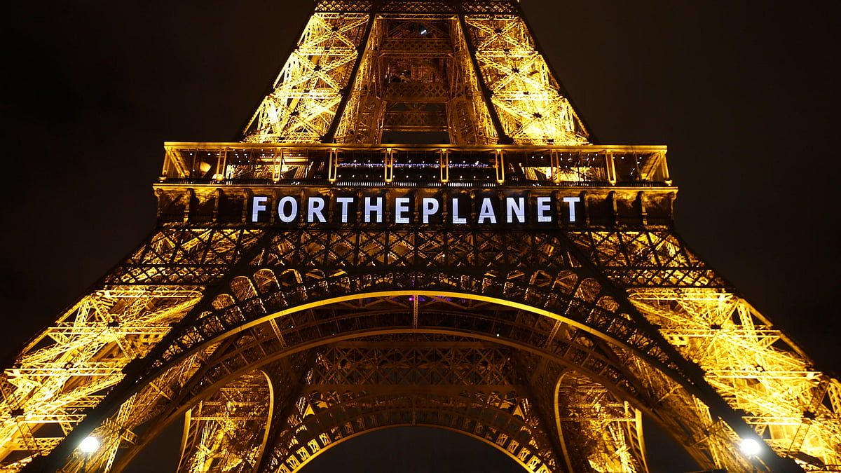 The slogan “FOR THE PLANET” projected on the Eiffel Tower as part of the COP21, United Nations Climate Change Conference in Paris, France. (Photo: AP)
