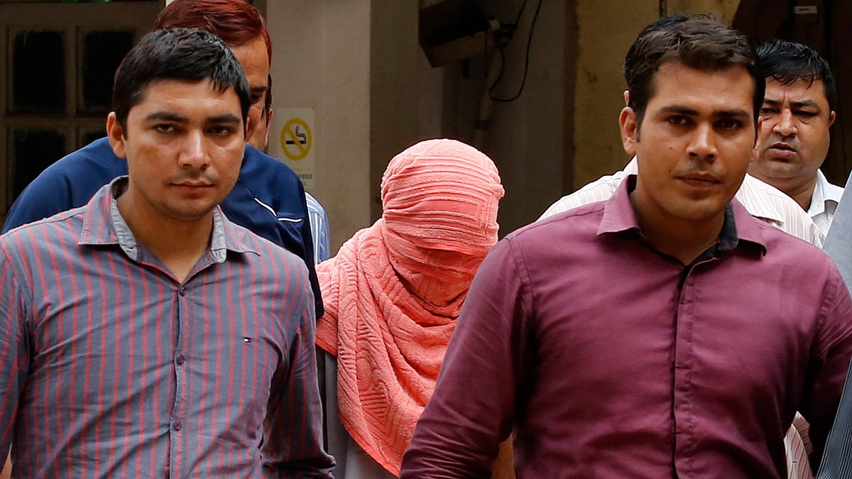 The juvenile convict (face concealed) in the Delhi gangrape case, whose impending release has sparked off a debate. (Photo : Reuters)