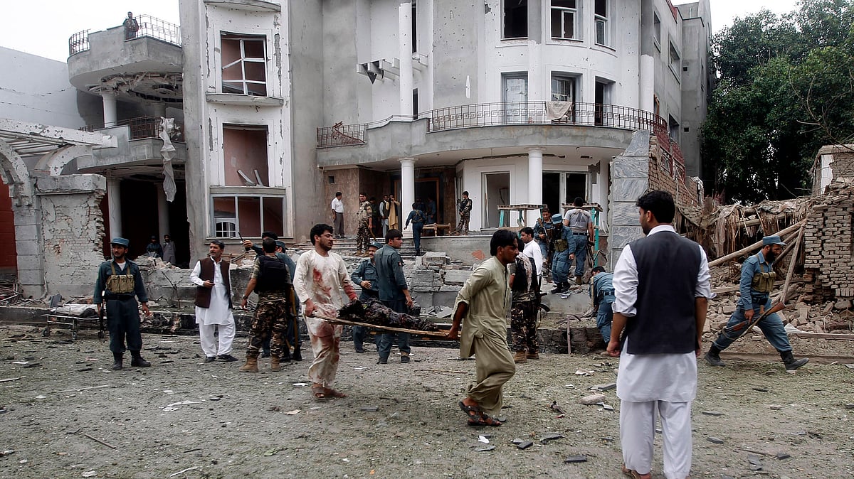 Remains of a dead body are carried away from the site of a suicide attack in Jalalabad province on August 3, 2013 after a suicide bomber attacked the Indian consulate. (Photo: Reuters)