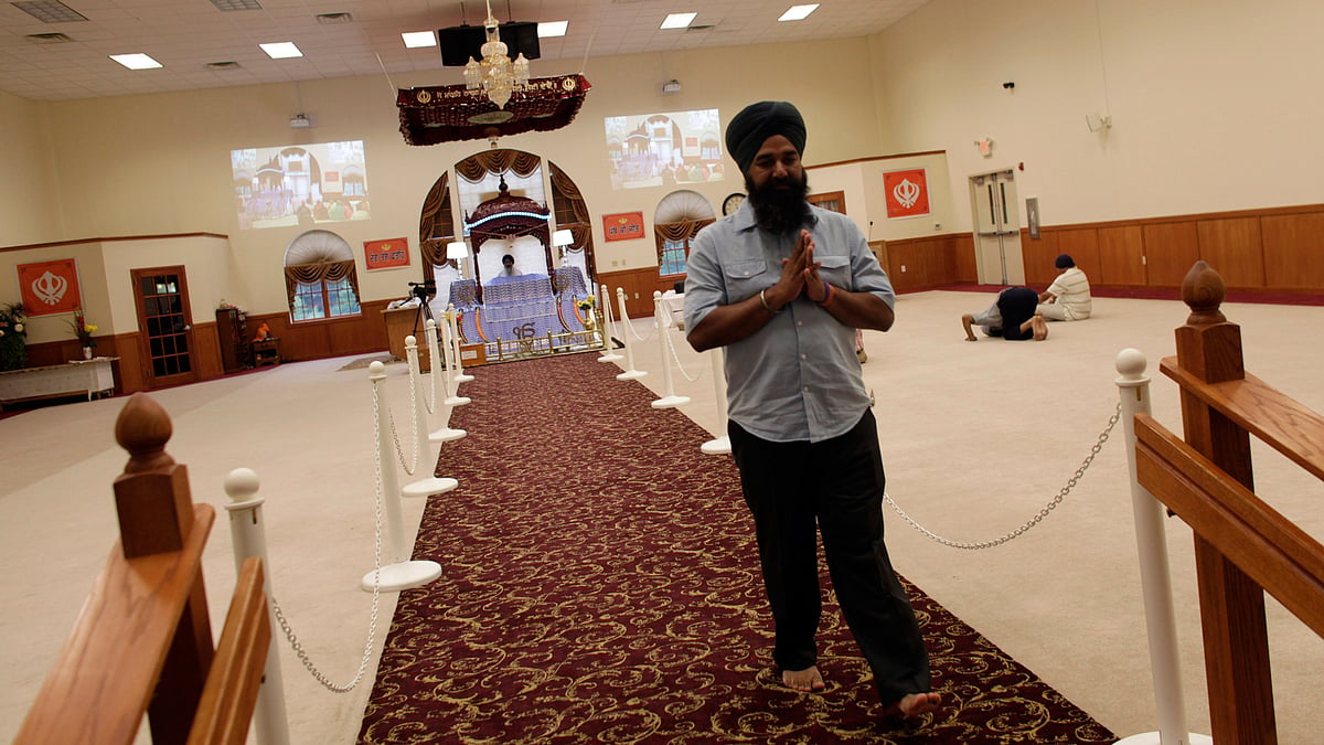 <div class="paragraphs"><p>Mourners pray before a candlelight vigil on the anniversary of a mass shooting at the Sikh Temple of Wisconsin, in Oak Creek, Wisconsin August 5, 2013. </p></div>