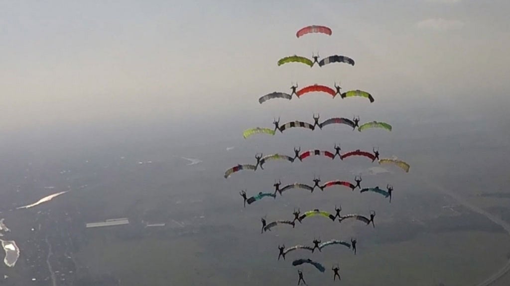 Skydivers create a Christmas tree-shaped formation in mid-air. (Photo: AP screengrab)