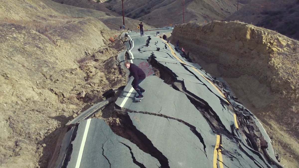 Breath-taking drone footage captures a daredevil transforming a highway devastated by a landslide into a skate park. (Photo: AP screengrab)