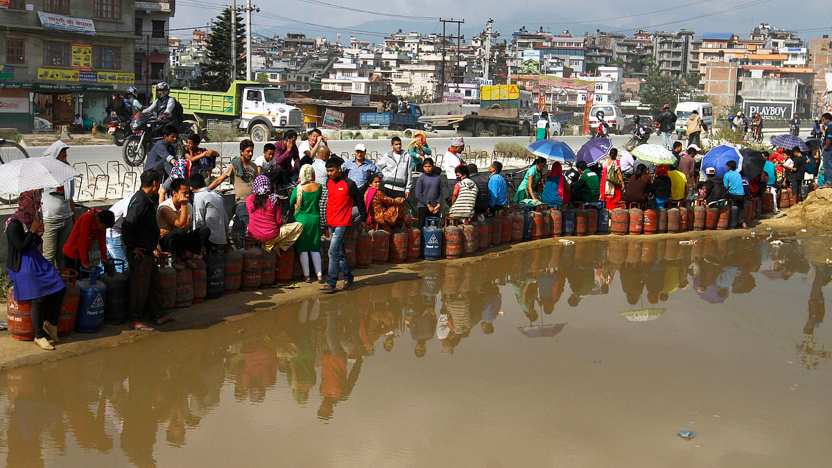 People stand in a long queue to buy fuel. (Photo Courtesy: Surbindra Kumar Pun)