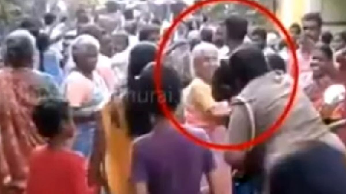 Screen grab of man snatching supplies. (Photo: Youtube)
