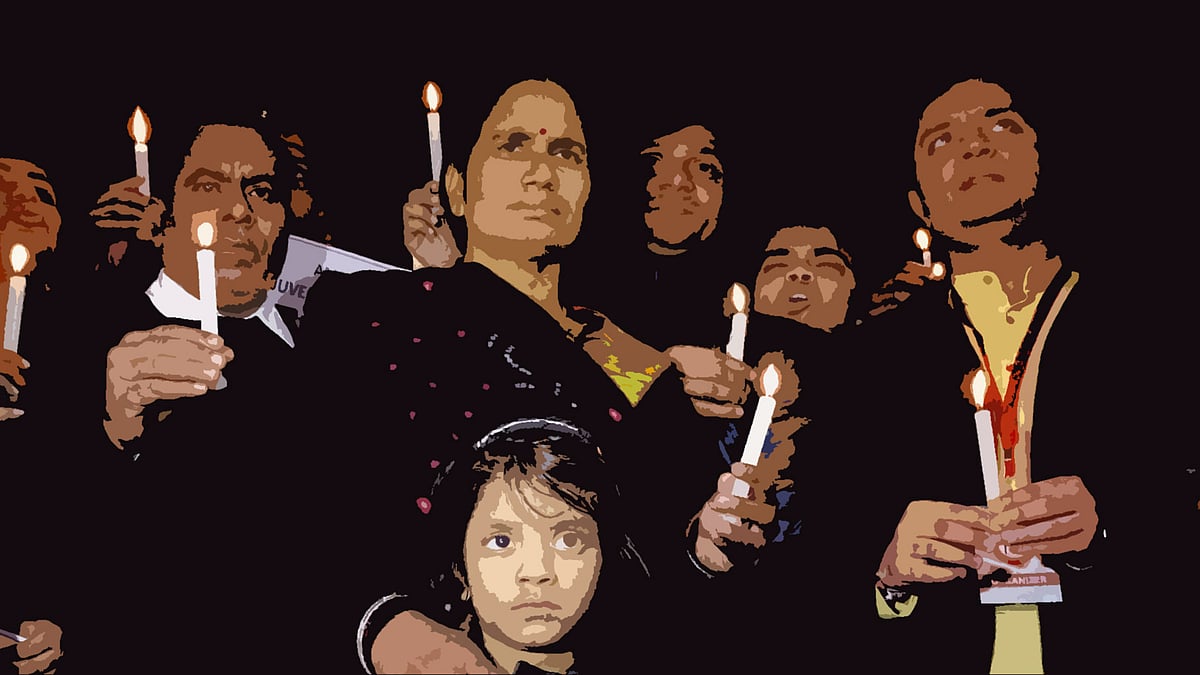 The parents of Jyoti Singh, also known as Nirbhaya, at a candlelight vigil in New Delhi. (Photo: PTI)