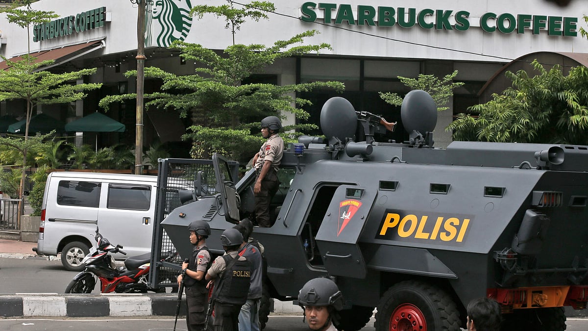 A police armoured vehicle is parked outside a Starbucks cafe after an explosion in Jakarta, Indonesia. (Photo: AP)