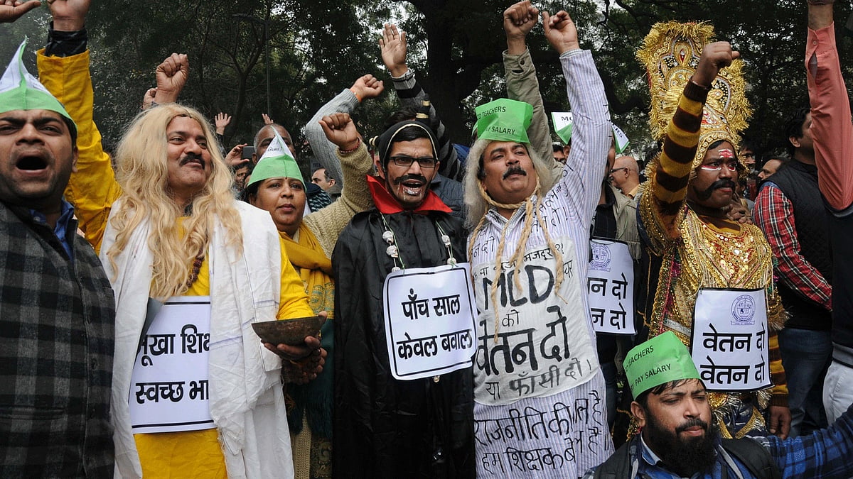 MCD workers stage a demonstration to press for release of their pending salaries in New Delhi. (Photo : IANS)