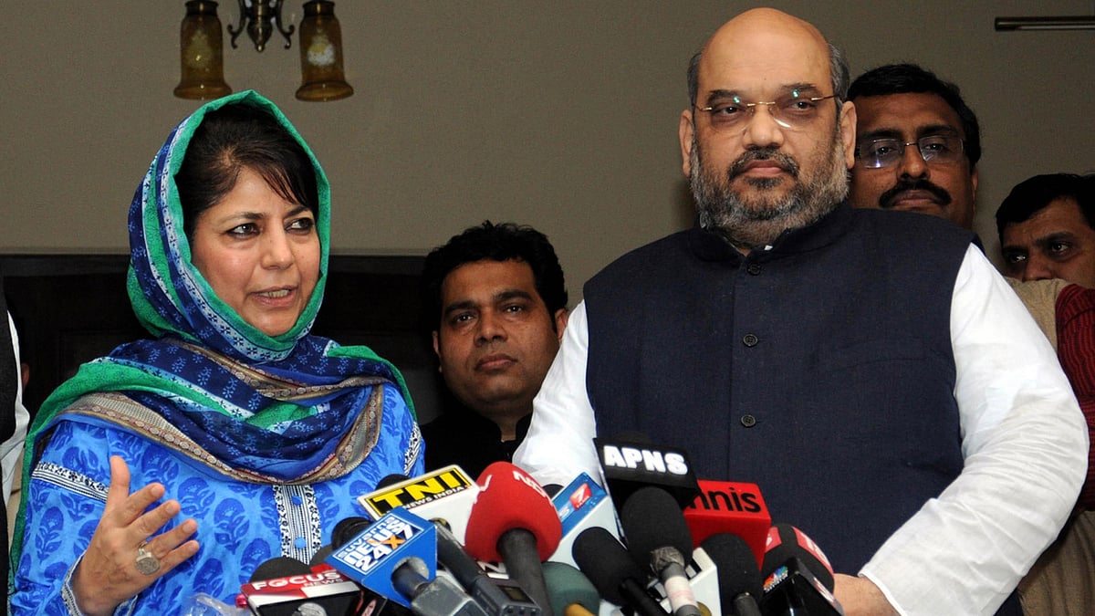 File photo of Mehbooba Mufti and BJP President Amit Shah. (Photo: PTI)