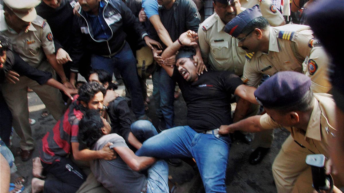Students being manhandled by the police. (Photo: PTI)