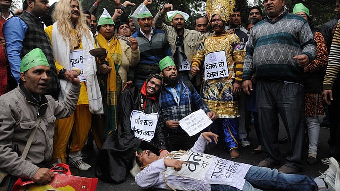 MCD workers stage a demonstration to press for release of their pending salaries in New Delhi. (Photo: IANS)