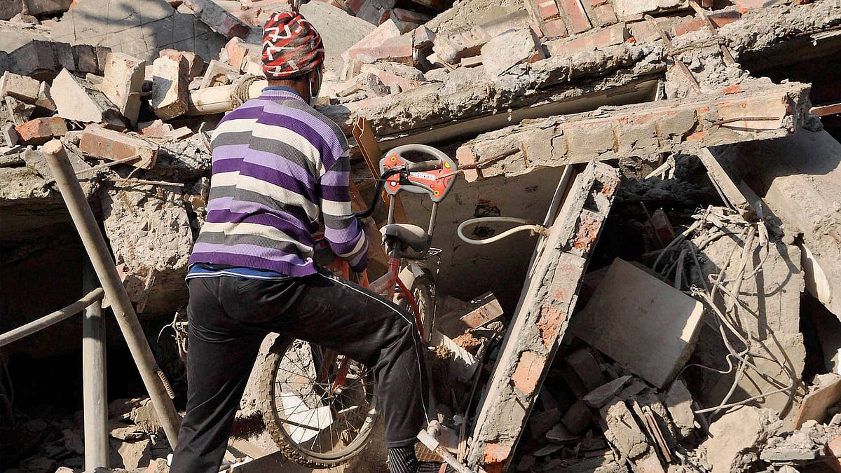 A collapsed house after a massive earthquake hit Imphal on Monday morning. (Photo: PTI)