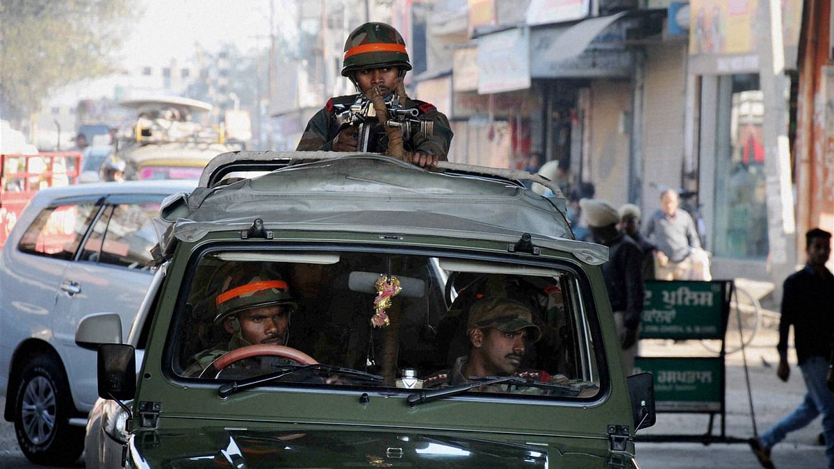 Indian soldiers stand guard outside the air base in Pathankot, Punjab. (Photo: PTI)