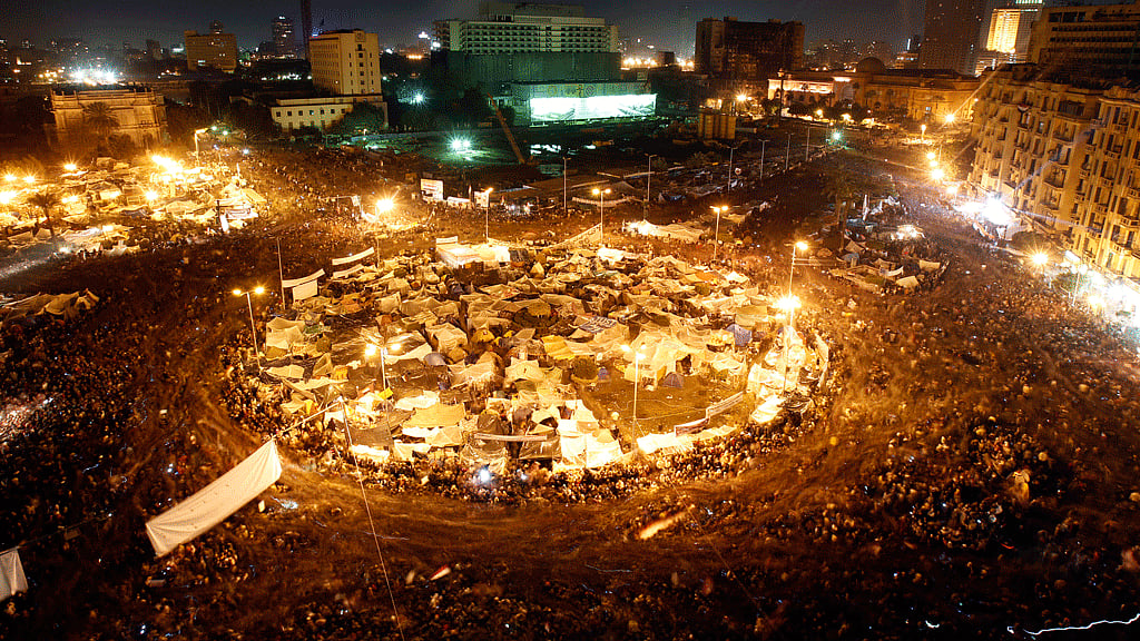 Anti-government protesters in Cairo’s Tahrir Square listen as President Hosni Mubarak speaks to the nation on 10 February 2011. (Photo: Reuters)