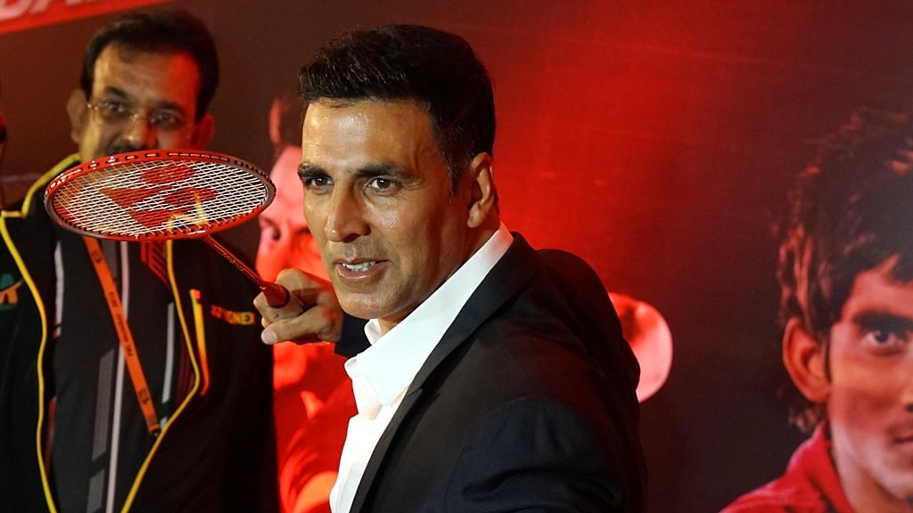 Akshay Kumar poses with a badminton racquet ahead of the Premier Badminton League final at New Delhi. 