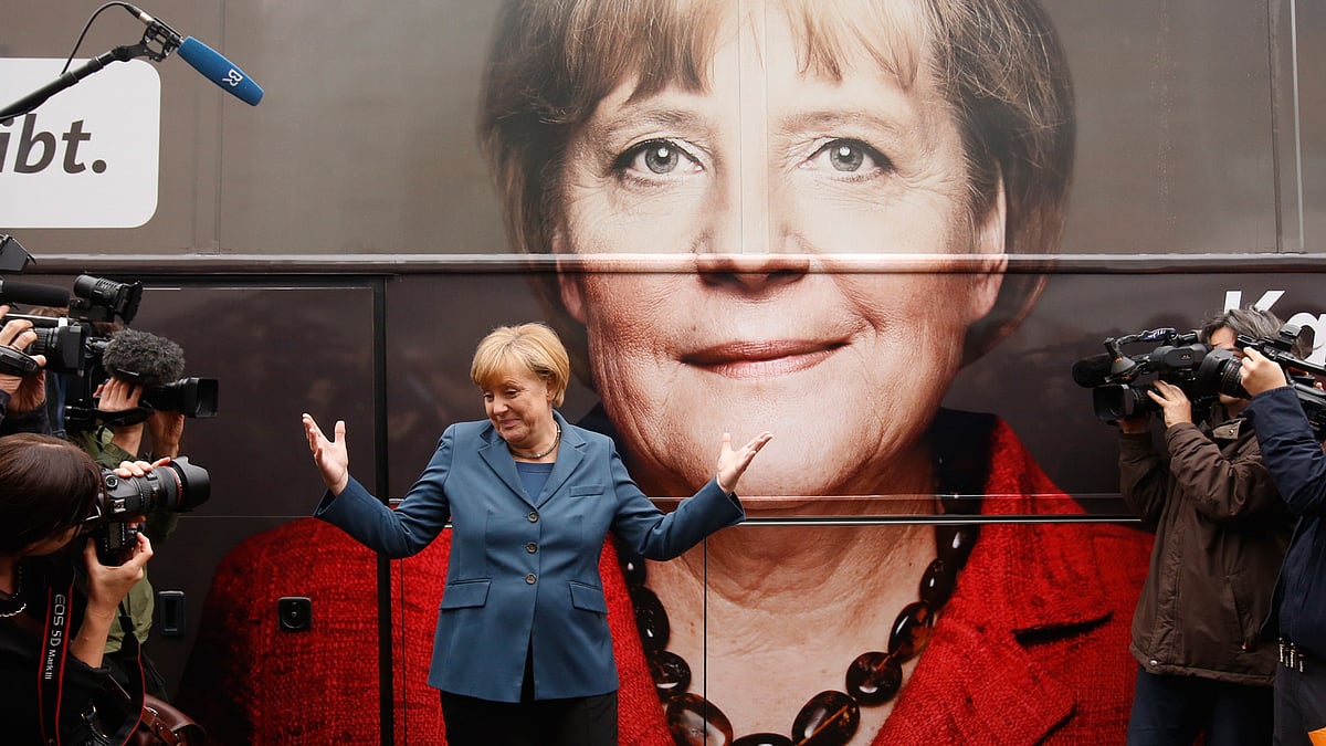 German Chancellor Angela Merkel stands in front of her election campaign tour bus in Berlin in 2013. (Photo: Reuters)