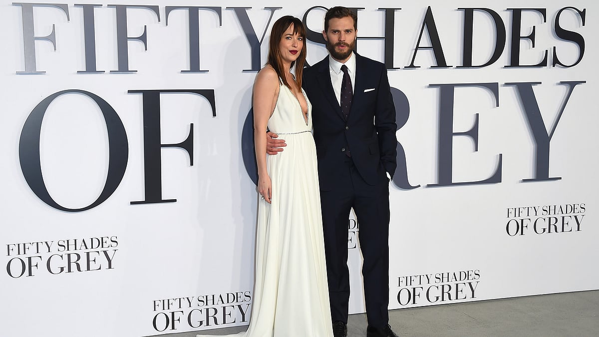 In this 12 Feb 2015 file photo, Dakota Johnson and Jamie Dornan pose for photographers at the UK premiere of Fifty Shades of Grey, at a central London cinema. “Fifty Shades of Grey” came out on top at this year’s Razzies. (Photo: AP)