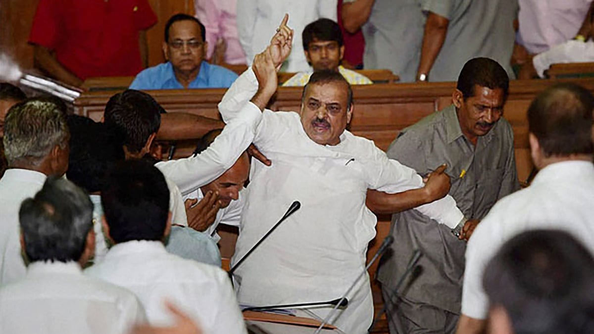 BJP MLA OP Sharma creating a ruckus in the Delhi Assembly. (Photo: PTI)