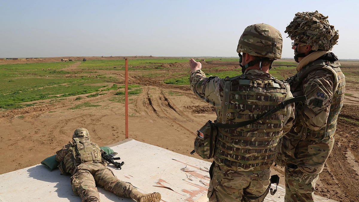 File photo of American and Spanish trainers using live ammunition in training exercises in Baghdad, Iraq. (Photo: AP)