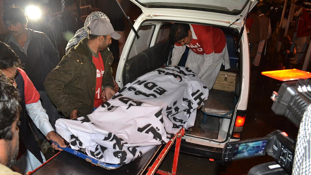 Body of a suspected terrorist being carried by hospital staff in Quetta, Pakistan on 6 February 2016. (Photo: IANS)