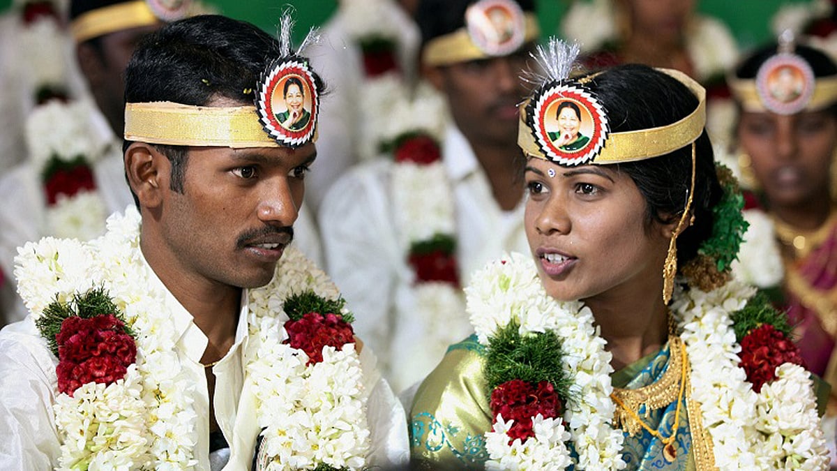 A couple at a mass marriage ceremony. (Photo Courtesy: <i>The News Minute</i>)
