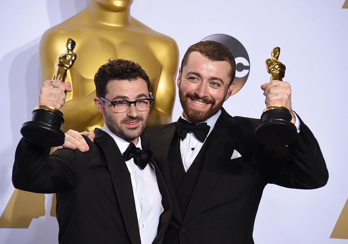 Jimmy Napes and Sam Smith hold up their awards. (Photo: AP)