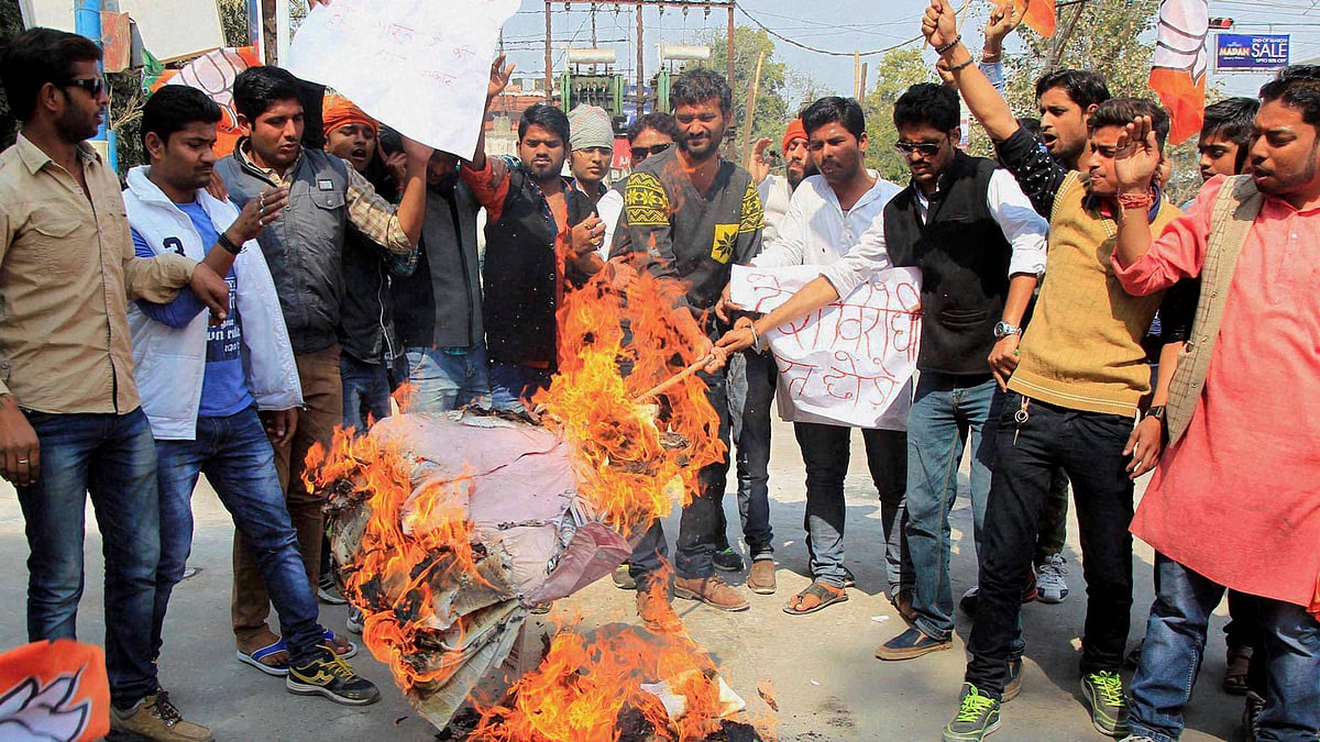 BJP workers shouts slogan during their protest against JNU student supporters of terrorist Hafiz sayeed in Allahabad on Sunday. (Photo: PTI)