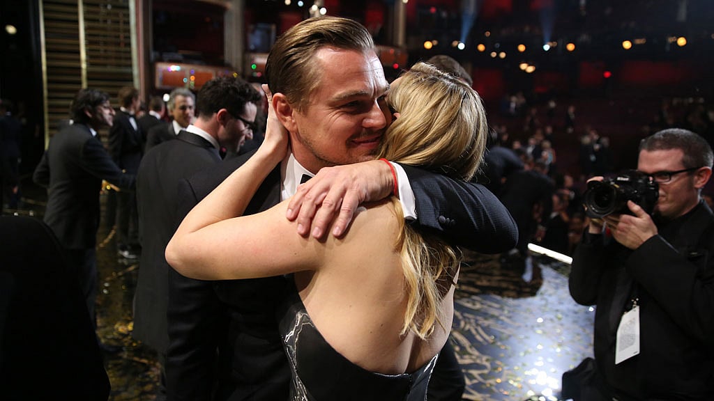 Leonardo DiCaprio embraces Kate Winslet backstage after winning Best Actor for The Revenant. (Photo: AP)