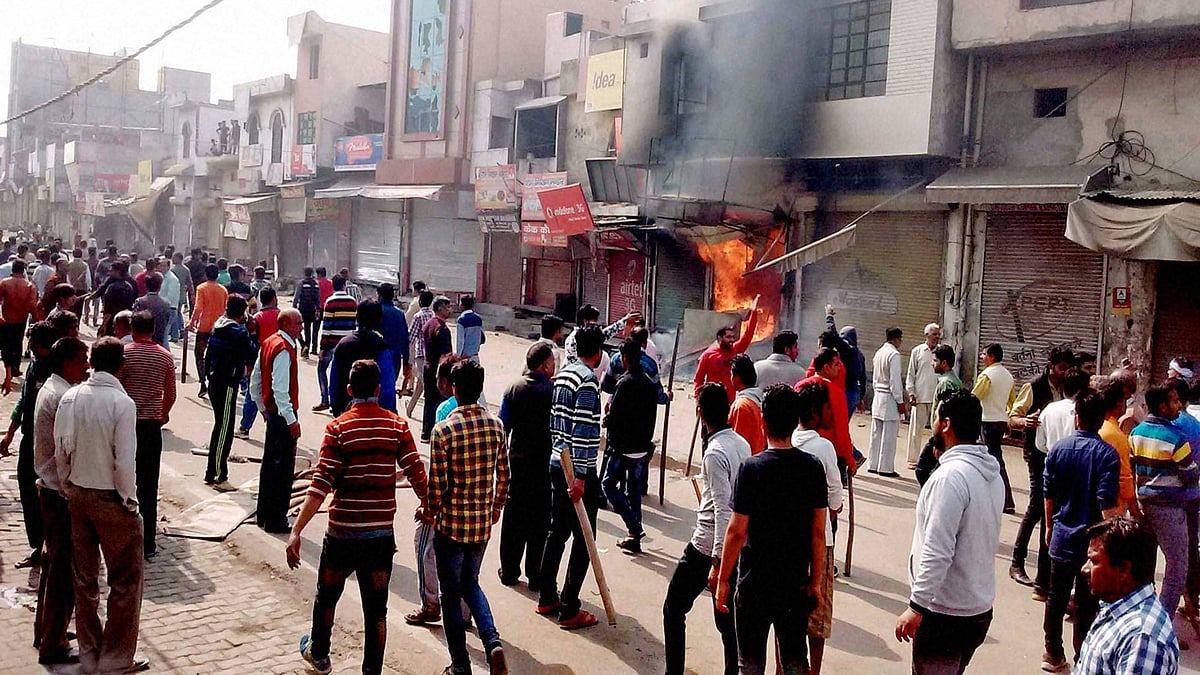 Protesters set shops on fire during Jat agitation in February 2016.