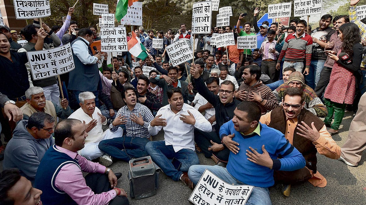  Residents of Munirka village protest outside JNU against the organising of a meet to “mourn” the hanging of  Afzal Guru. (Photo: PTI)