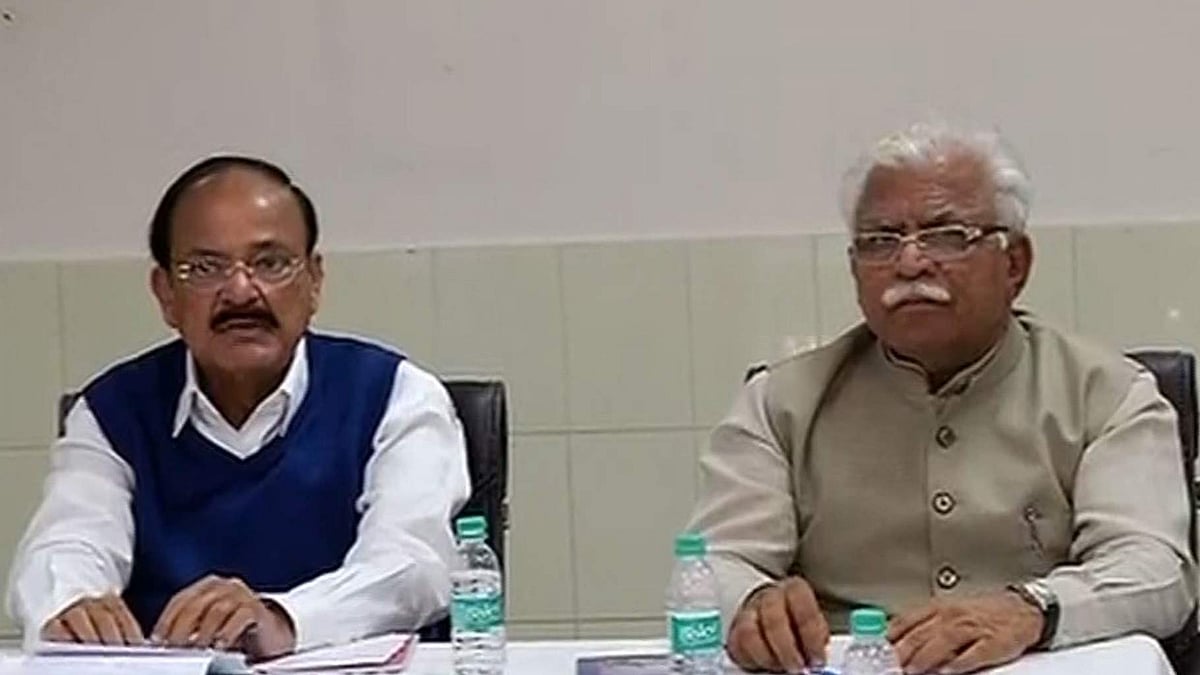 Union Minister M Venkaiah Naidu and Haryana Chief Minister Manohar Lal Khattar discussing the Jat quota agitation. (Photo: ANI Screengrab)