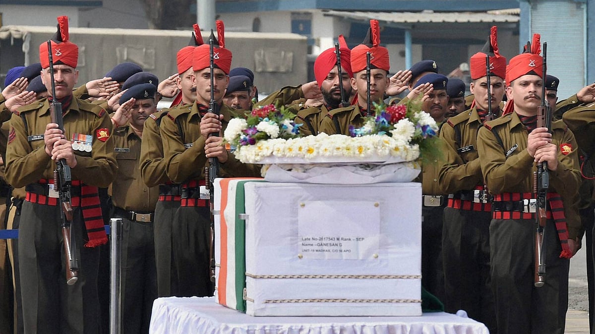 Jawans pay  last respects to the mortal remains of Siachen avalanche victims  at Air Force Station, Palam in New Delhi on Monday, 15 February. (Photo: PTI)