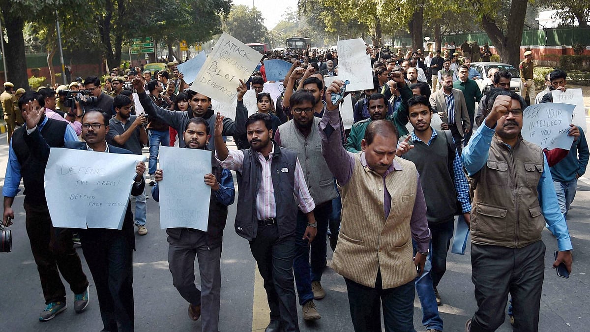 Journalists display placards at a protest march from Press Club of India to the Supreme Court in protest against the Mondays attack on media persons and JNU students. (Photo: PTI)