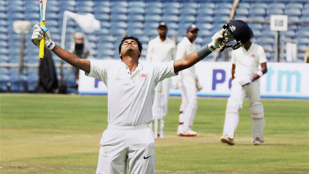 Mumbai’s Shreyas Iyer raises his bat after scoring a century in the Ranji trophy final. (Photo: PTI)