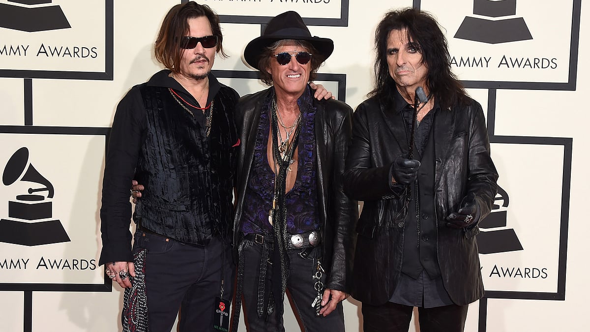 Who knew? Johnny Depp, Joe Perry and Alice Cooper at the 58th Grammy Awards red carpet. (Photo: AP)